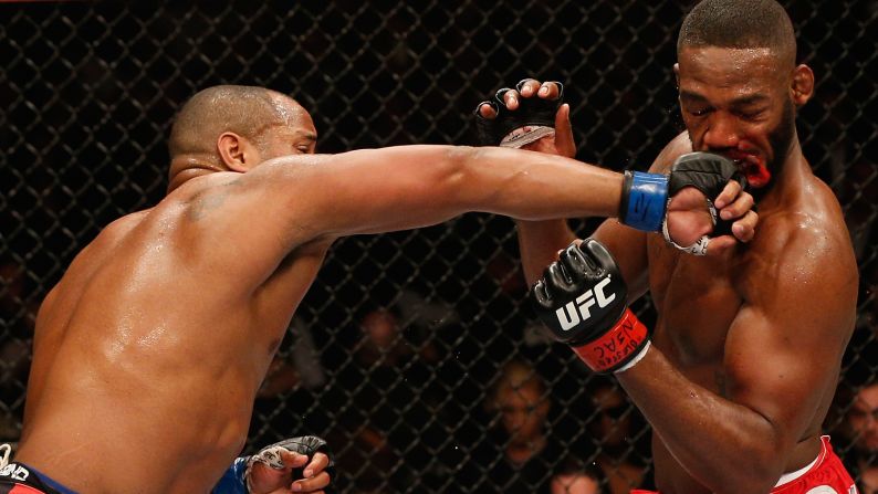 Daniel Cormier punches UFC champion Jon Jones during their title fight Saturday, January 3, in Las Vegas. Jones won by unanimous decision, however, to retain his light-heavyweight crown.