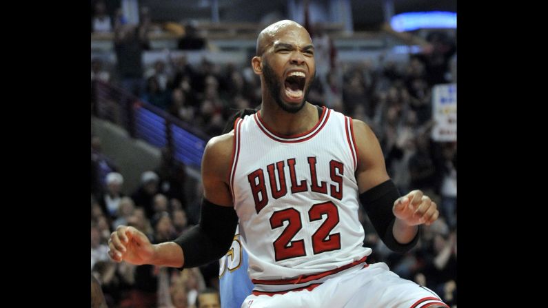 Chicago's Taj Gibson celebrates a dunk during an NBA game against Denver on Thursday, January 1.