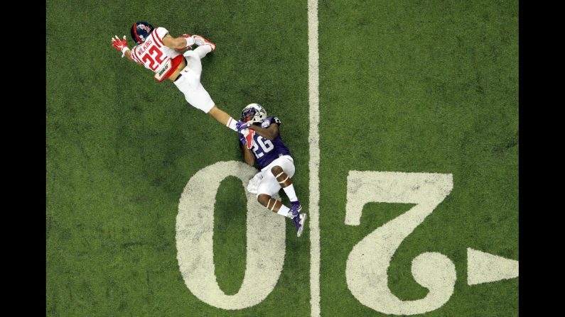 TCU safety Derrick Kindred tackles Ole Miss running back Jordan Wilkins during the Peach Bowl, which was played in Atlanta on Wednesday, December 31. TCU dominated the Rebels 42-3 and finished the season with a 12-1 record.