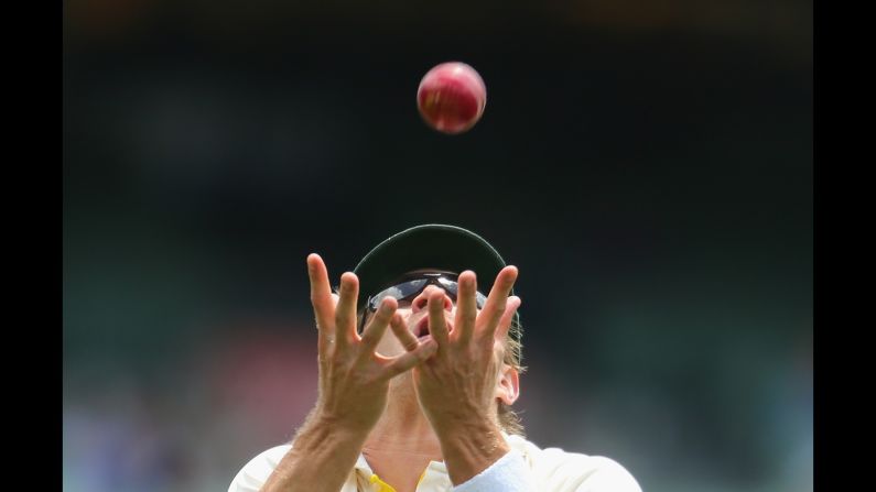 Australian cricket player Shane Watson makes a catch against India on Tuesday, December 30, during a third Test match between the two countries. The match in Melbourne ended in a draw after Australia won the previous two. <a href="index.php?page=&url=http%3A%2F%2Fwww.cnn.com%2F2014%2F12%2F30%2Fworldsport%2Fgallery%2Fwhat-a-shot-1230%2Findex.html" target="_blank">See 30 amazing sports photos from last week</a>