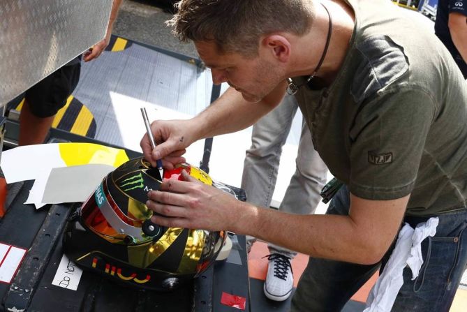 Nico Rosberg paid tribute to Germany's football World Cup winners at the German Grand Prix.  Rules stated he couldn't depict the World Cup trophy on his helmet but the four gold stars did the trick for the Mercedes driver... he won the race!