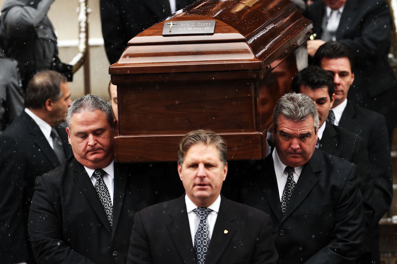 Cuomo's casket is carried from the church.
