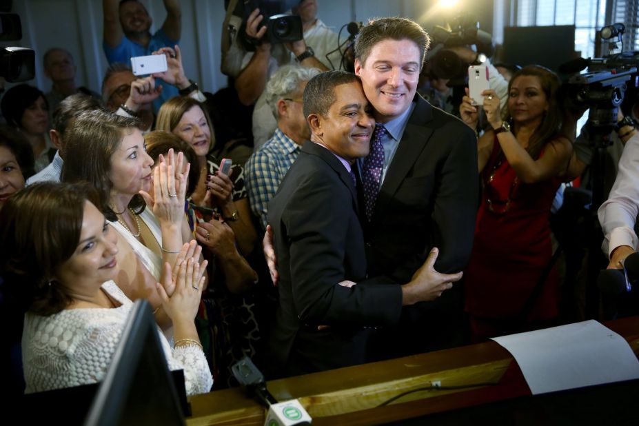 Newlyweds Jeff Delmay and Todd Delmay hug during a marriage ceremony in a Miami courtroom January 5, 2015. Florida began allowing same-sex marriages after a federal judge struck down the state's ban.