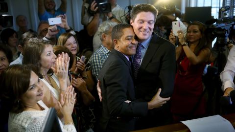Newlyweds Jeff Delmay and Todd Delmay hug during a marriage ceremony in a Miami courtroom January 5, 2015. Florida began allowing same-sex marriages after a federal judge struck down the state's ban.