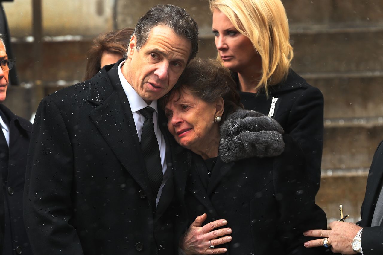 New York Gov. Andrew Cuomo comforts his mother, Matilda, on Tuesday, January 6, as he watches his father's casket depart St. Ignatius Loyola Church in New York City. Former New York Gov. <a href="http://www.cnn.com/2015/01/01/politics/gallery/mario-cuomo/index.html" target="_blank">Mario Cuomo</a> died Thursday, January 1, at the age of 82.