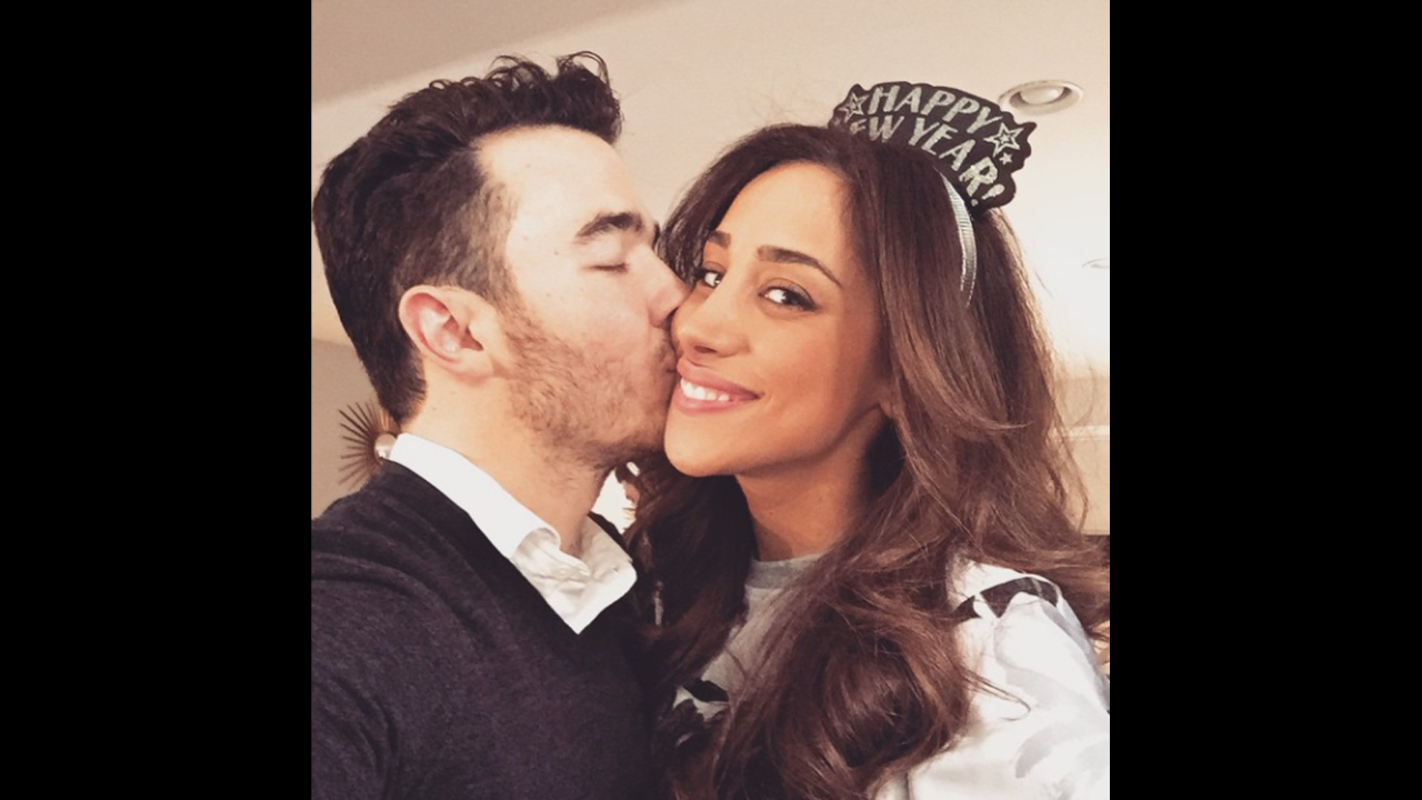 Singer Kevin Jonas smooches his wife, Danielle, on Thursday, January 1. "New year same love and it's perfect," <a href="http://instagram.com/p/xTUqzaj-WU/?modal=true" target="_blank" target="_blank">he said on Instagram.</a>