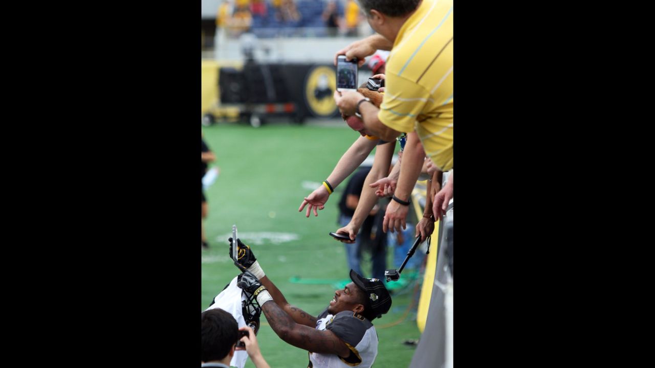 Missouri running back Marcus Murphy takes a selfie with fans on Thursday, January 1, after his team defeated Minnesota at the Citrus Bowl in Orlando, Florida.