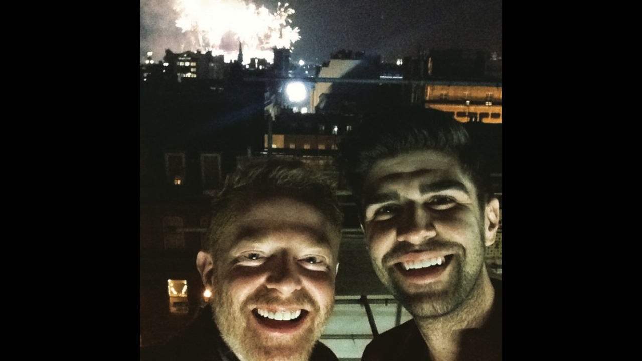 "Happy New Years from London!" wrote actor Jesse Tyler Ferguson as he posted this selfie with his husband, Justin Mikita.