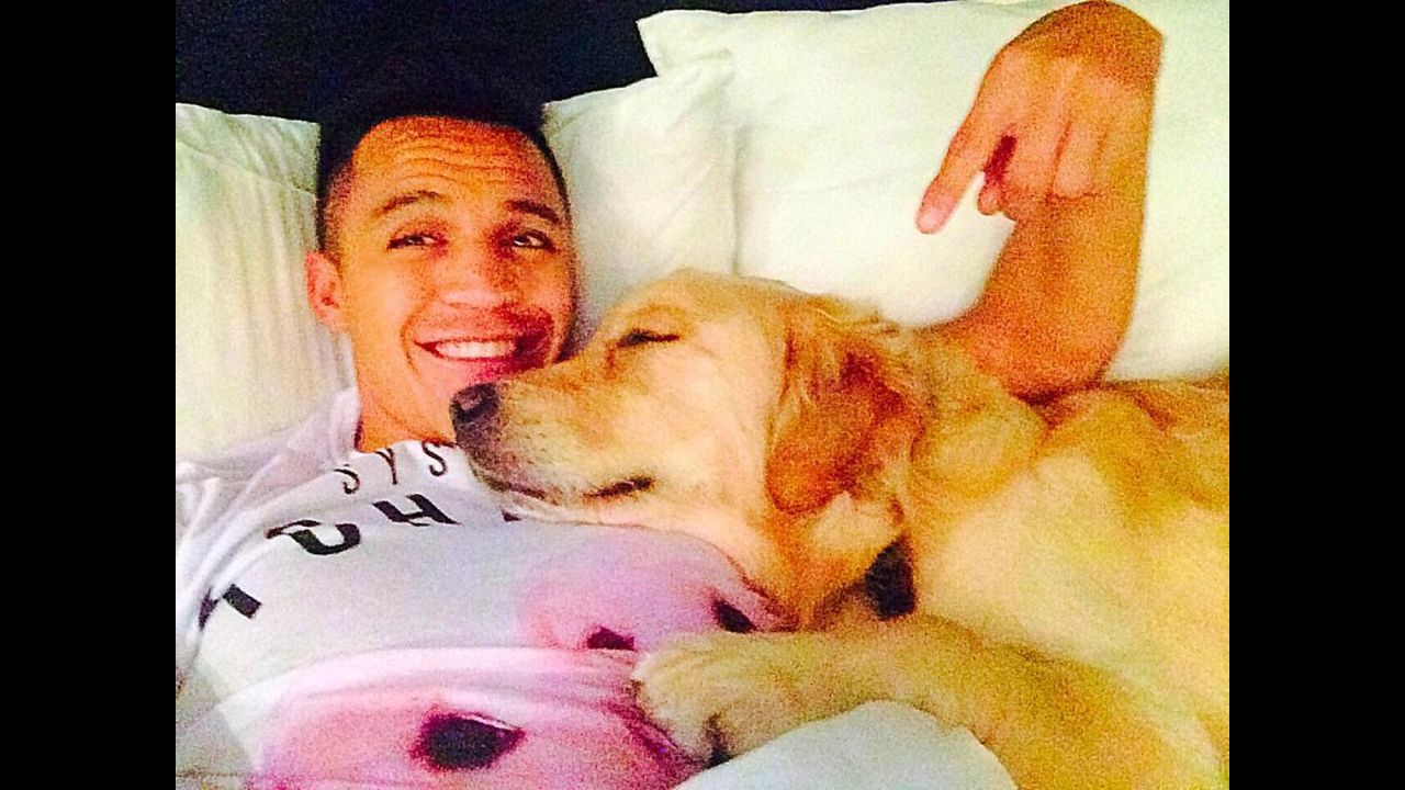 Arsenal soccer star Alexis Sanchez gets cozy with his dog in this selfie <a href="https://twitter.com/Alexis_Sanchez/status/551156528062156801/photo/1" target="_blank" target="_blank">he tweeted</a> Friday, January 2.