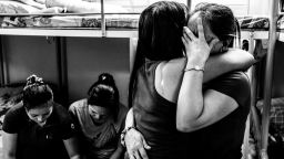 Two women comfort each other during a sharing session at Bethune House Migrant Women's Refuge, a shelter for abused domestic workers in Hong Kong. Xyza Cruz Bacani works as a maid six days a week and spends her day off documenting their stories.