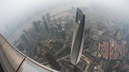 Caption:A general view shows the Shanghai World Financial Center and the skyline of the Lujiazui Financial District in Pudong, seen from the 109th floor of the Shanghai Tower (still under construction), covered in smog in Shanghai on October 16, 2014. China has for years been hit by heavy air pollution, caused by enormous use of coal to generate electricity to power a booming economy, and more vehicles on the roads. AFP PHOTO / JOHANNES EISELE (Photo credit should read JOHANNES EISELE/AFP/Getty Images)