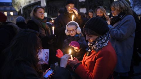 People light candles at the Place de la Republique on January 7.