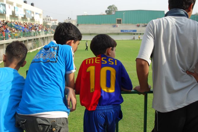 Palestinian kids are riveted by their favorite up and coming football players.