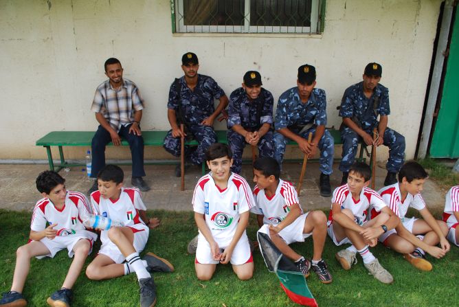 Wearing their Palestinian kit, children from Gaza get ready for football practice.
