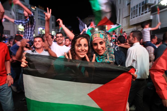 Hundreds of fans pour onto the street to celebrate the Palestinians' historic success. The Asian Cup will be the first time they have competed in a major international tournament. The Palestinians will make their debut against defending champion Japan in Newcastle, Australia, on Monday.