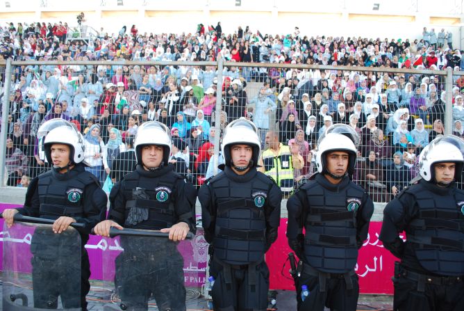 Palestinian policemen guard a stand full of female spectators at the first women's home match in 2009. <a href="index.php?page=&url=http%3A%2F%2Fedition.cnn.com%2F2009%2FSPORT%2Ffootball%2F11%2F06%2Fpalestinian.womens.football.westbank%2F" target="_blank">Read: Women flock to see first female football game in West Bank</a>