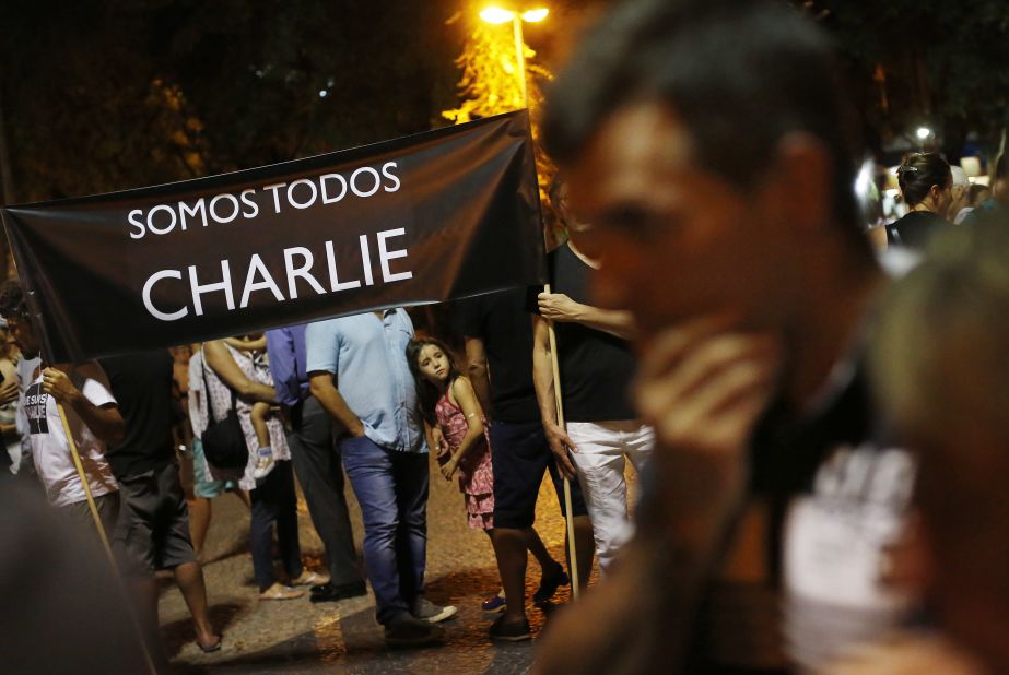 People in Rio de Janeiro hold a sign that reads "We're all Charlie" on January 7.