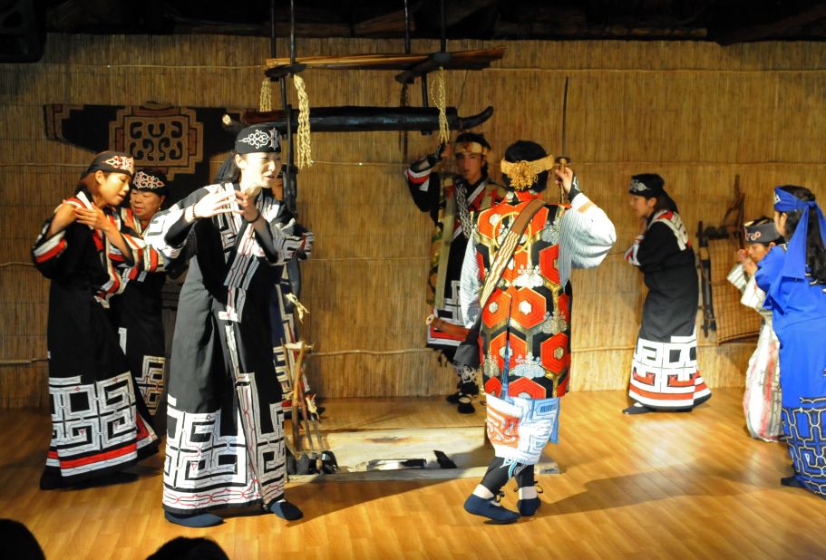 On the shores of Hokkaido's Lake Poroto, the recreated Ainu village hosts regular folk dance displays.