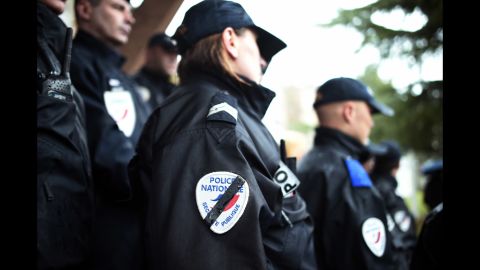 Police observe a moment of silence January 8 in Rennes, France.
