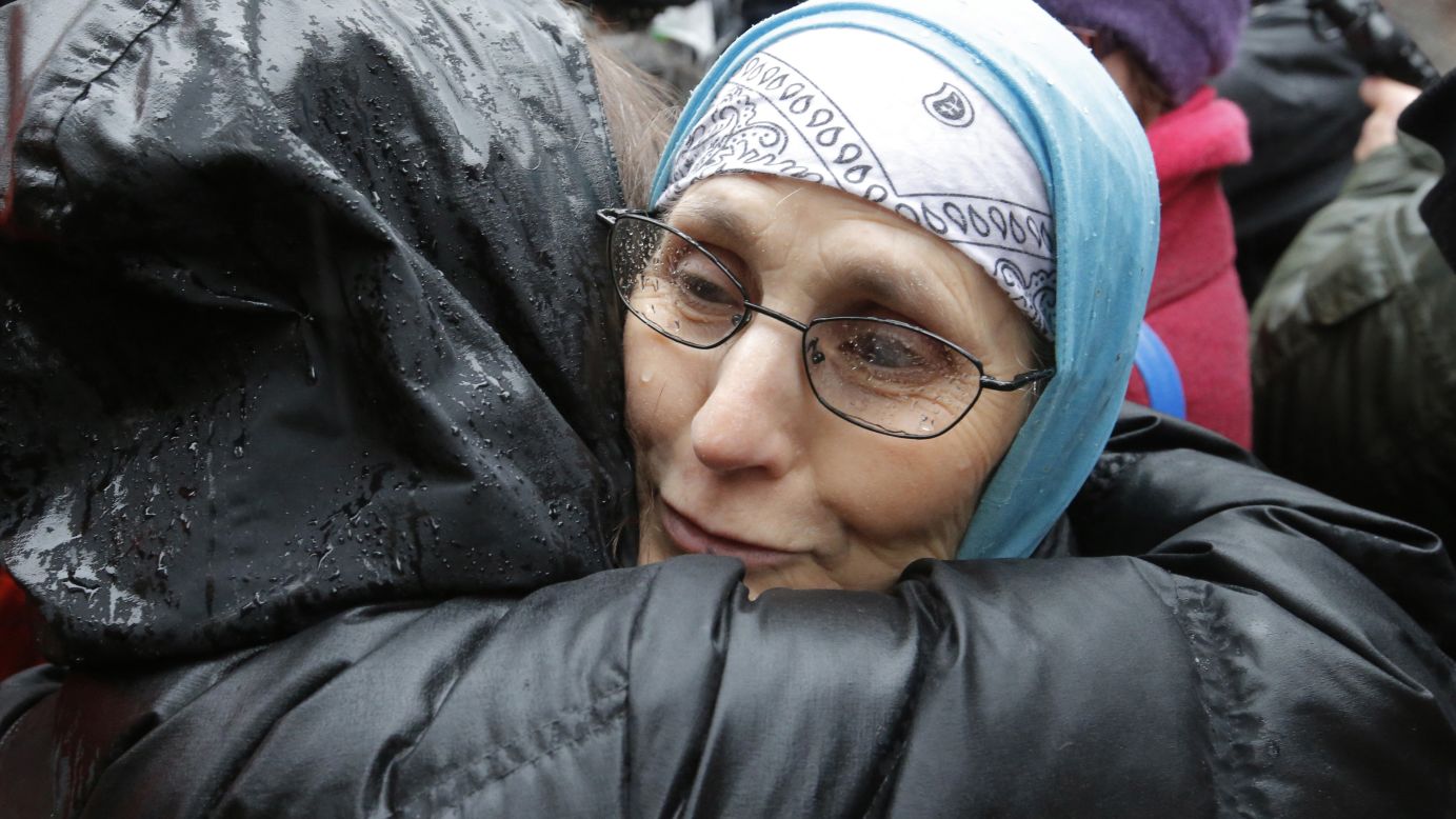 Women hug each other during a solidarity rally outside the office of Charlie Hebdo on January 8.