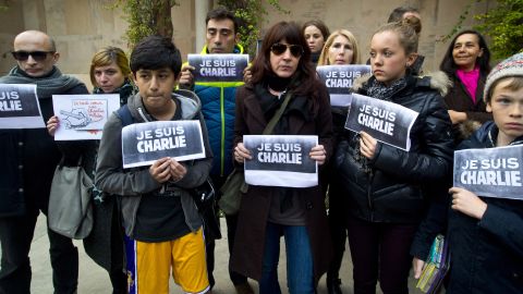 French journalists and their families show solidarity with the Paris victims outside the French Embassy in New Delhi on January 8.