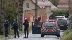 Members of GIPN and of RAID, French police special forces, are pictured in Corcy, near Villers-Cotterets, north-east of Paris, on January 8, 2015, where the two armed suspects from the attack on French satirical weekly newspaper Charlie Hebdo were spotted in a gray Clio. French security forces deployed on January 8 in a northern town where two brothers suspected of having gunned down 12 people in an Islamist attack on satirical magazine Charlie Hebdo abandoned their car, a police source said. Cherif Kouachi, 32, a jihadist well-known to police, and his brother Said, 34, were spotted by the manager of a petrol station in the town about an hour's drive northeast of Paris, who after being robbed "formally identified" the two men. AFP PHOTO / FRANCOIS NASCIMBENI        (Photo credit should read FRANCOIS NASCIMBENI/AFP/Getty Images)