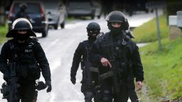 Members of GIPN and of RAID, French police special forces, are pictured in Corcy, near Villers-Cotterets, north-east of Paris, on January 8, 2015, where the two armed suspects from the attack on French satirical weekly newspaper Charlie Hebdo were spotted in a gray Clio.