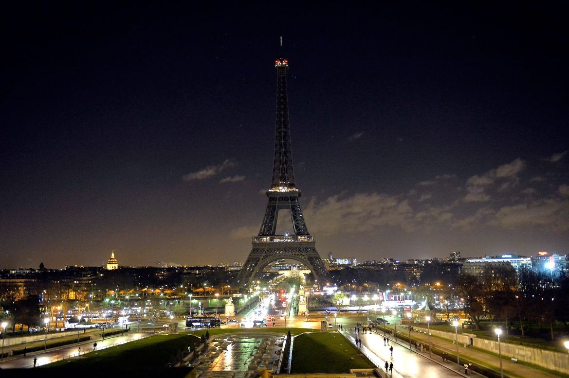 In remembrance of the victims, the Eiffel Tower goes dark on January 8.