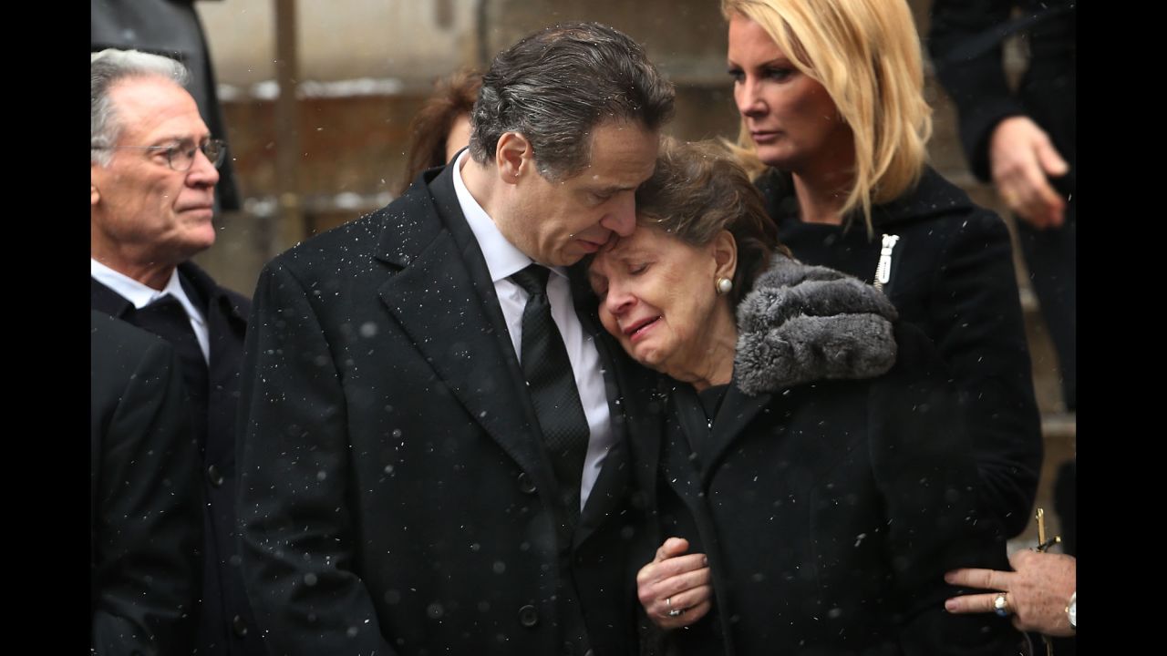 New York Gov. Andrew Cuomo comforts his mother, Matilda, on Tuesday, January 6, as he watches his father's casket depart St. Ignatius Loyola Church in New York City. Former New York Gov. <a href="http://www.cnn.com/2015/01/01/politics/gallery/mario-cuomo/index.html" target="_blank">Mario Cuomo</a> died Thursday, January 1, at the age of 82.