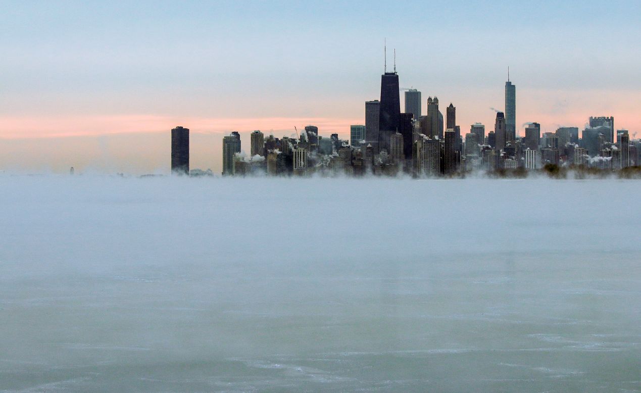 Steam rises over Lake Michigan near the Chicago skyline on Thursday, January 8. The National Weather Service predicted heavy rains and mountain snow in the Northwest and snow from the northern Plains to the northern Mid-Atlantic states.