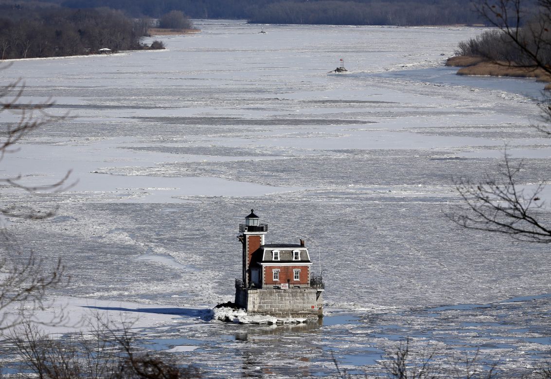 The Hudson-Athens Lighthouse is surrounded by the icy waters of the Hudson River on January 8 in Hudson, New York.