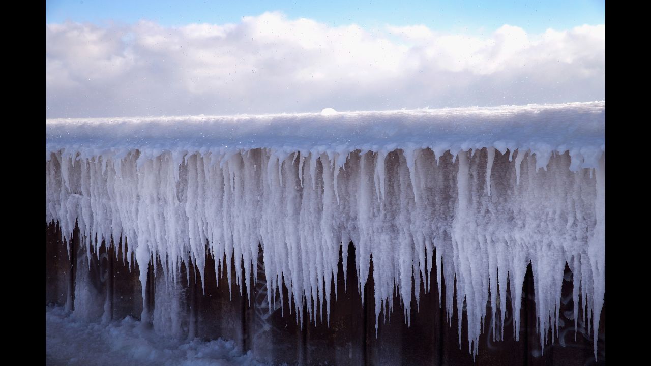 Ice builds up along Chicago's North Avenue Pier while temperatures hovered around zero degrees Fahrenheit on Wednesday, January 7.