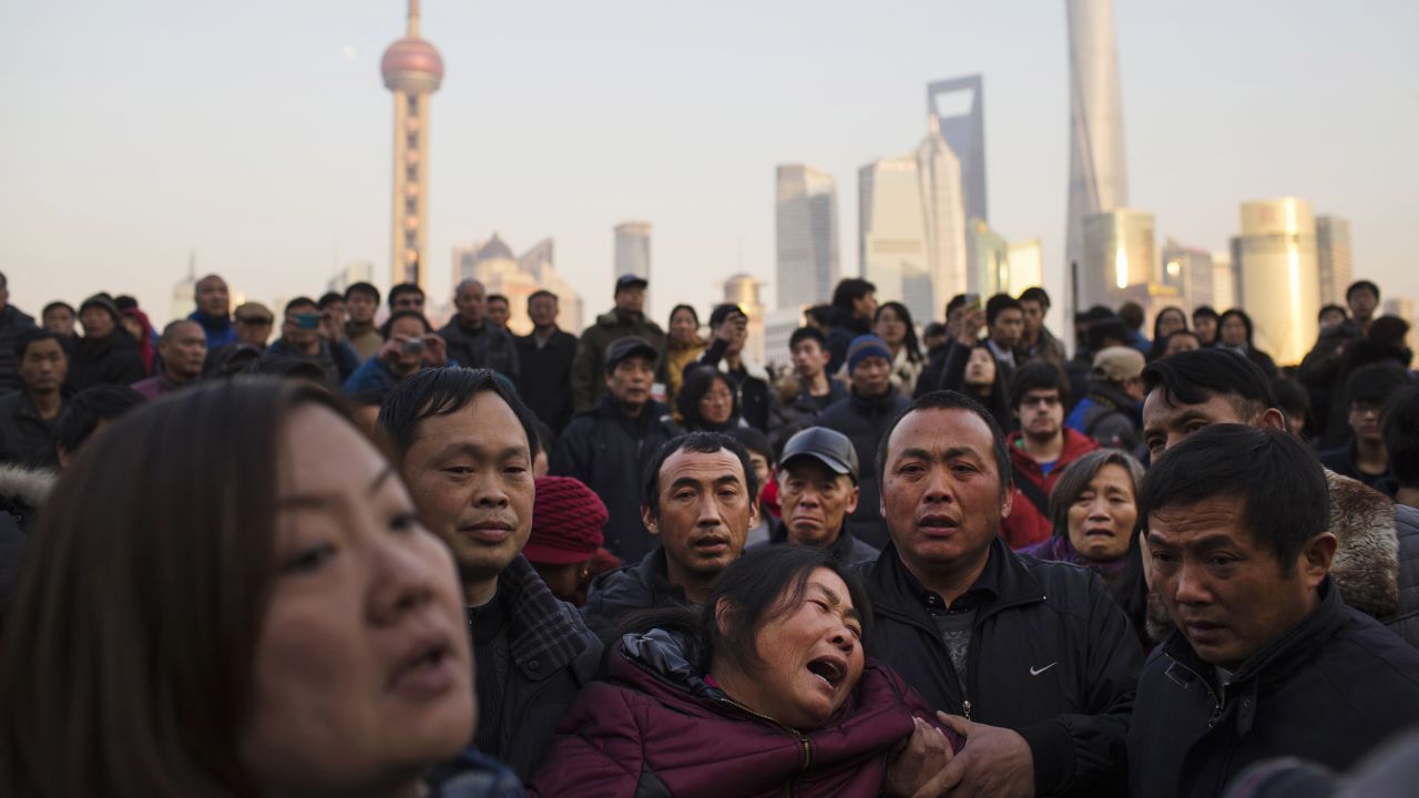 A woman cries where <a href="http://www.cnn.com/2015/01/02/world/asia/china-shanghai-new-years-stampede/index.html" target="_blank">at least 36 people were killed in a stampede</a> during a New Year's celebration in Shanghai, China. The woman is the mother of one of the victims.
