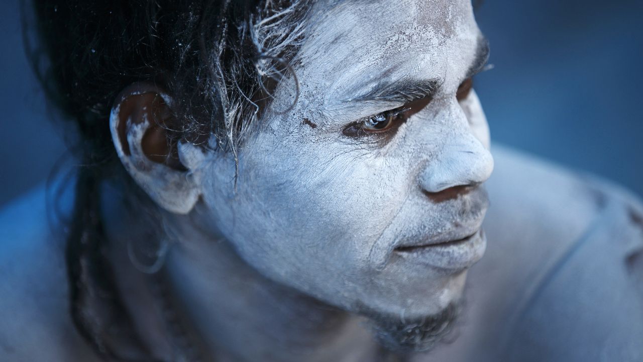 A Hindu holy man sits near a fire to keep himself warm on Monday, January 5, the first day of the Swasthani Brata Katha festival in Kathmandu, Nepal.