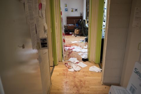 Blood is seen on the floor and desks in the Charlie Hebdo newsroom on January 7.