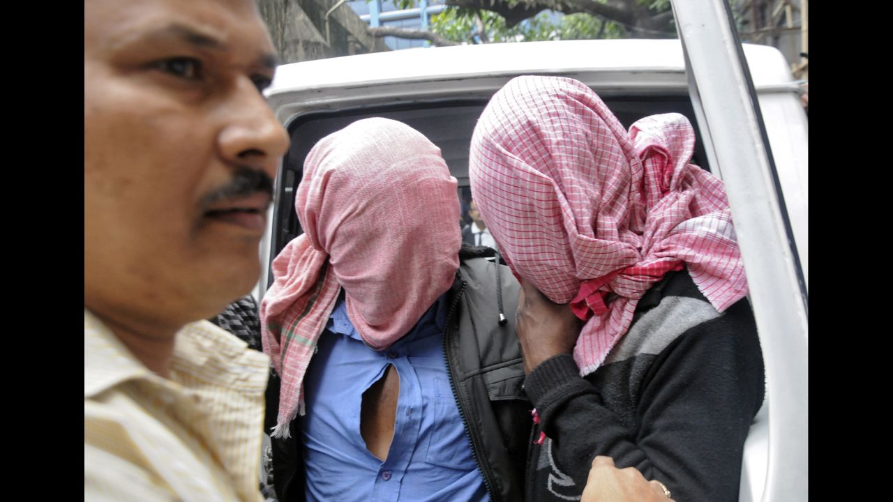 A plainclothes policeman, left, escorts two men who were arrested in connection with the alleged abduction and gang rape of a Japanese tourist in Kolkata, India, on Saturday, January 3. <a href="http://www.cnn.com/2015/01/04/asia/india-tourist-rape-accusations/index.html" target="_blank">Five men were arrested in all. </a>