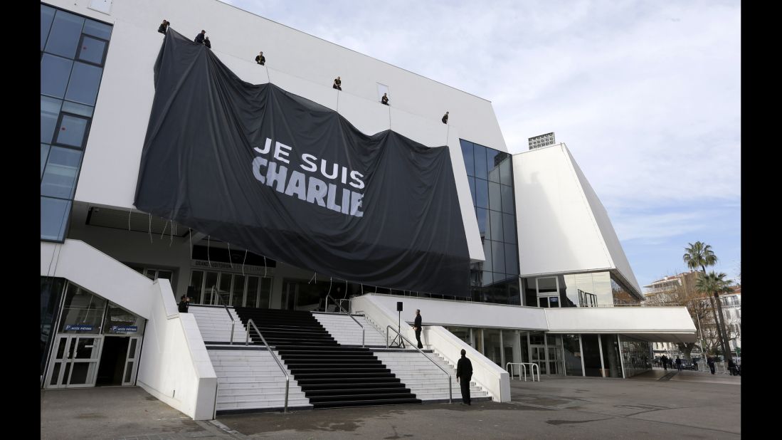 Workers install a giant banner on the Cannes Festival Palace in Cannes, France, on January 9. 