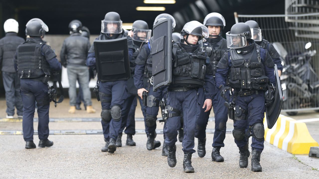 Police gather at the site of the standoff.