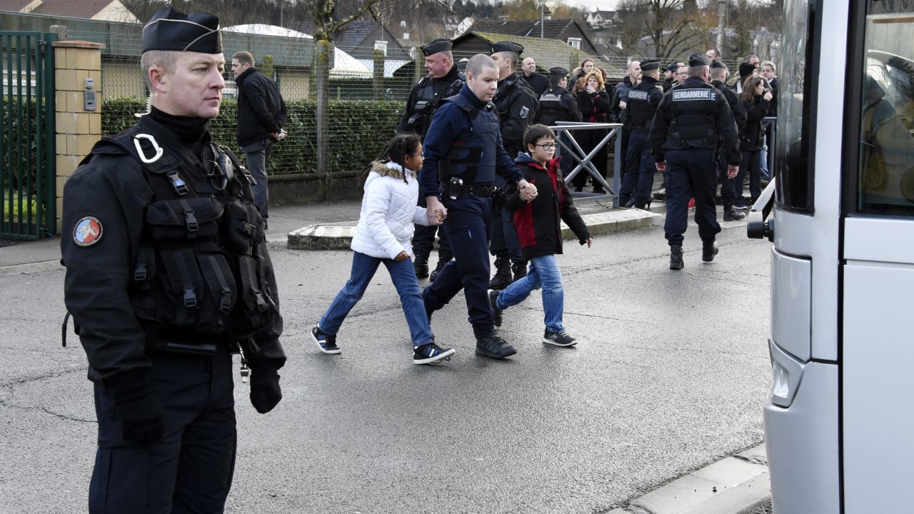 French gendarmes stand guard as a nearby school is evacuated in Dammartin-en-Goele on January 9.