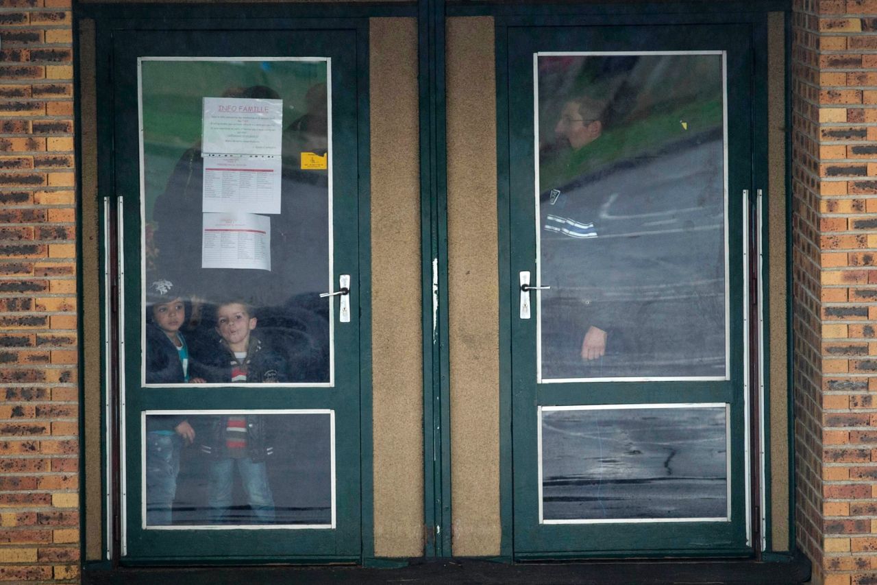 Children wait inside a school before being picked up by their parents. Dammartin-en-Goele residents were told to stay inside during the standoff, and schools were put on lockdown, the mayor's media office told CNN.