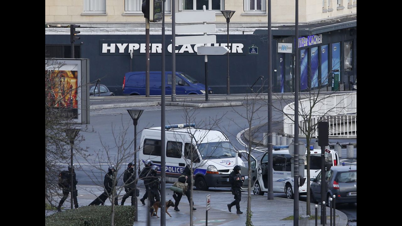 French police on the move near the grocery store.