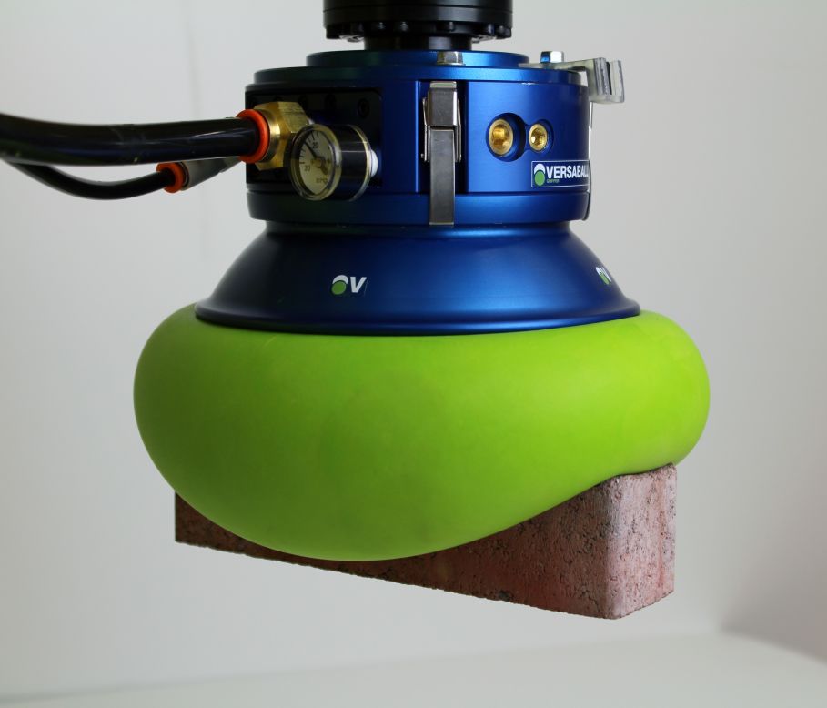 <a href="http://empirerobotics.com/#" target="_blank" target="_blank">Empire Robotic's</a> Versaball is filled with a "sand like material." When air is pumped into the ball it softens, molding around an object, and then when air is removed, the green ball hardens and grips objects from bricks to ping pong balls.