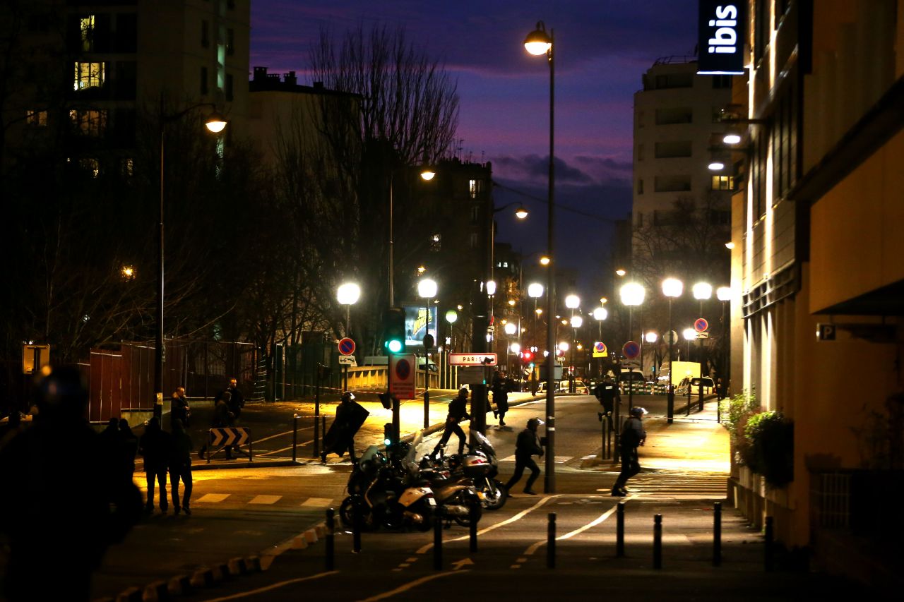 Police mobilize at the scene in Paris. One of the hostages told CNN affiliate BFMTV that the gunman started shooting "as soon as he got inside" and killed two customers.