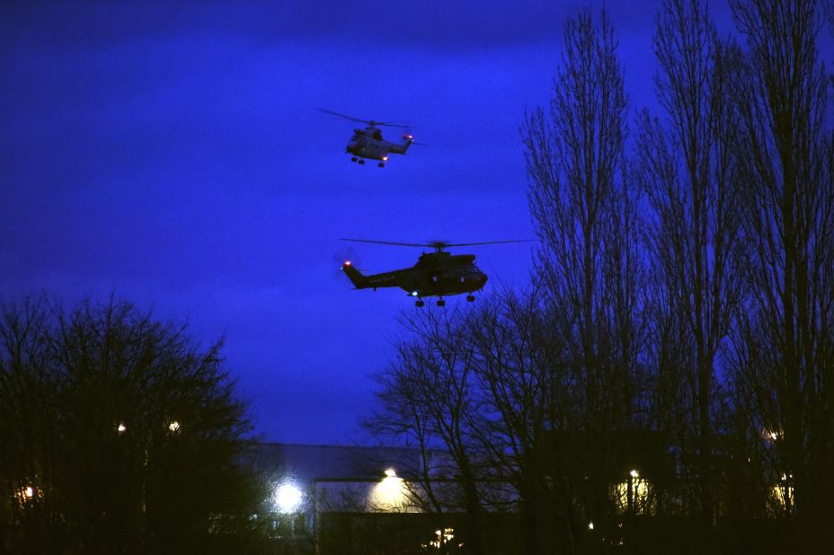 Helicopters fly over a printing shop in Dammartin-en-Goele, France, where there was a standoff Friday, January 9, between police and two men suspected in <a href="http://www.cnn.com/2015/01/07/world/gallery/paris-charlie-hebdo-shooting/index.html" target="_blank">the Charlie Hebdo shootings</a> earlier this week. Cherif and Said Kouachi, the two brothers wanted in the case, were killed by security forces, authorities said.