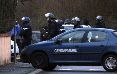 Police officers leave after storming the printing shop in Dammartin-en-Goele on January 9.