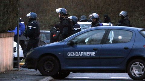 Police officers leave after storming the building in Dammartin-en-Goele.