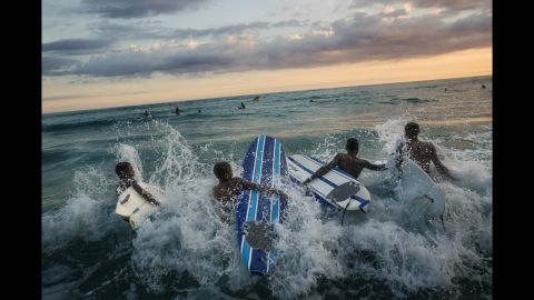 Children surf on the beaches of Jacmel, the province worst hit by the Haiti earthquake in January 2010. Photographer Marco Gualazzini recently visited the country to see how far it has come since the disaster.