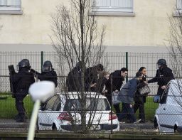 French police special forces evacuate local residents in Saint-Mande, near Porte de Vincennes, eastern Paris.