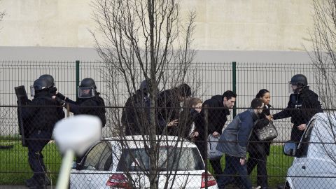 French police special forces evacuate local residents in Saint-Mande, near Porte de Vincennes, eastern Paris.