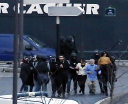 French police special forces evacuate hostages after launching the assault at a kosher grocery store in Porte de Vincennes in eastern Paris.